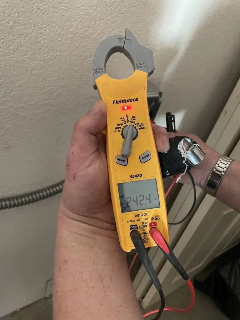 Voltage testing with clamp meter during Aluminum Wiring Replacement in Waldron